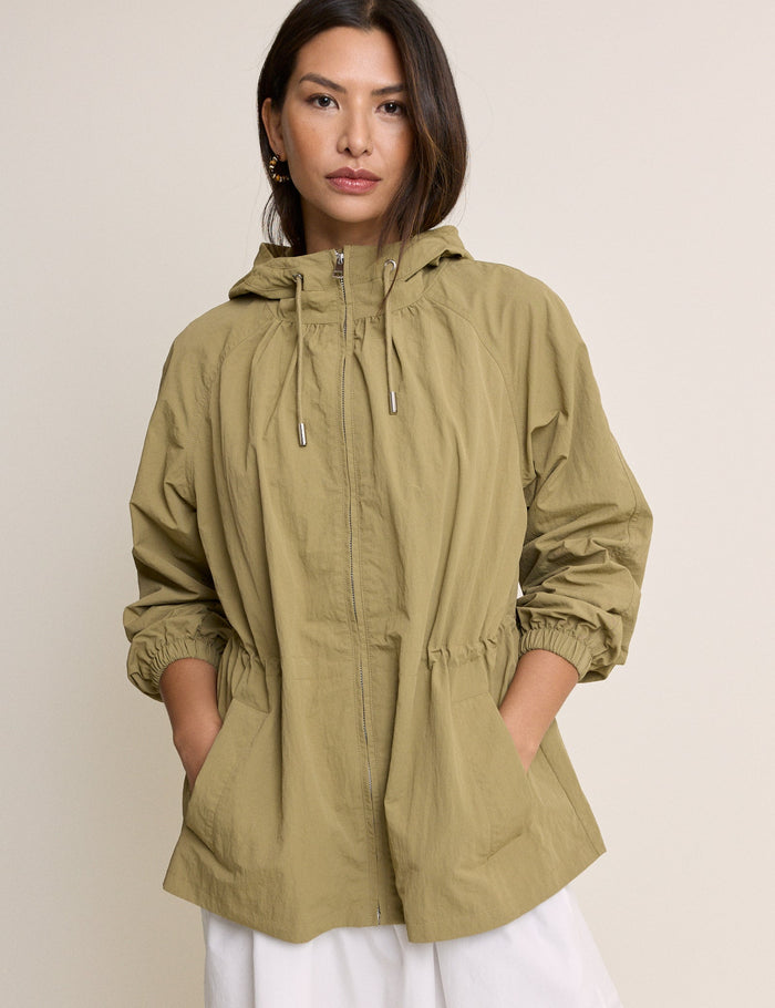 Soft khaki coloured drawstring waist parka.