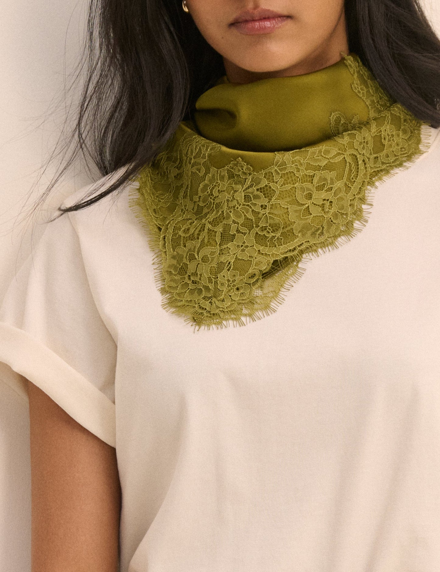 Olive green satin scarf with lace trim.