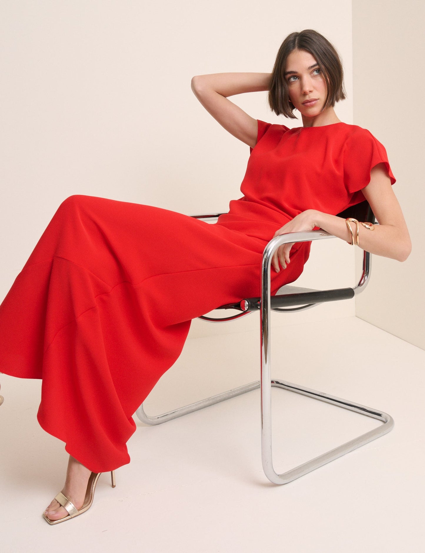 Vibrant red flowing maxi dress.