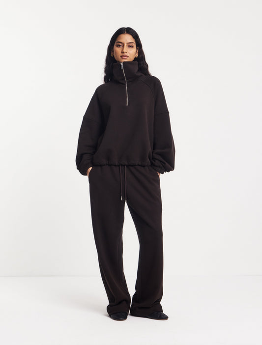 Dark brown tracksuit bottoms.