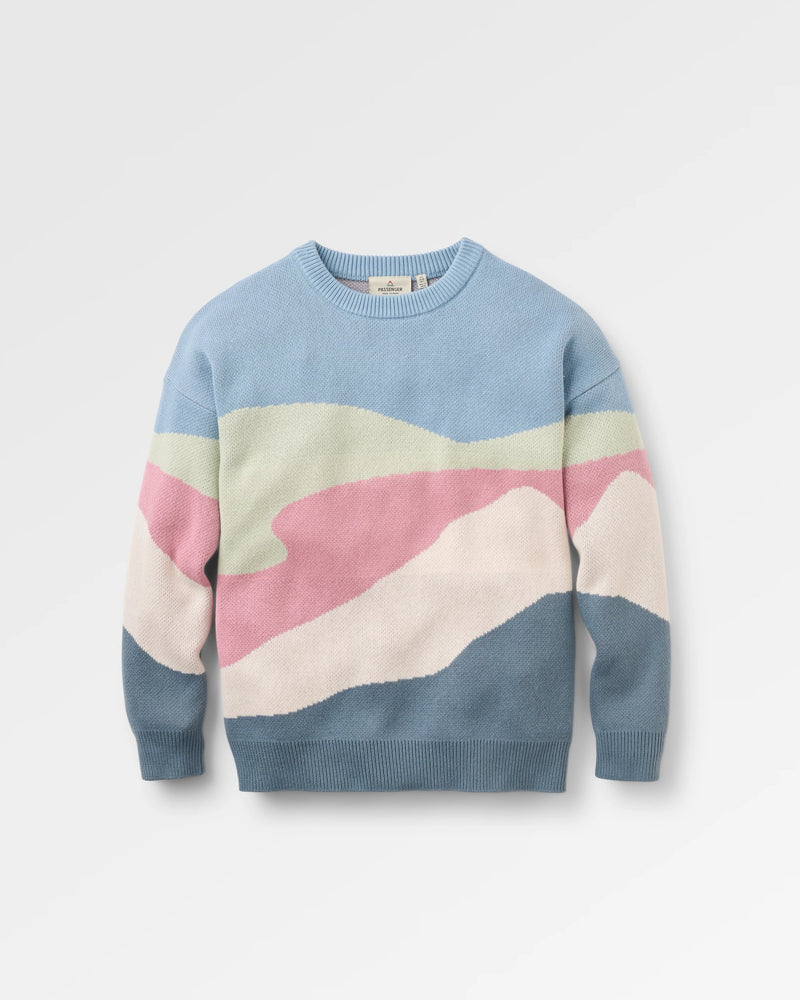 Colour-blocked sweater with pastel shades on a light grey background