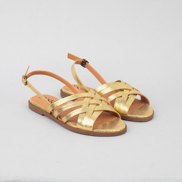 Gold slingback flat sandals.