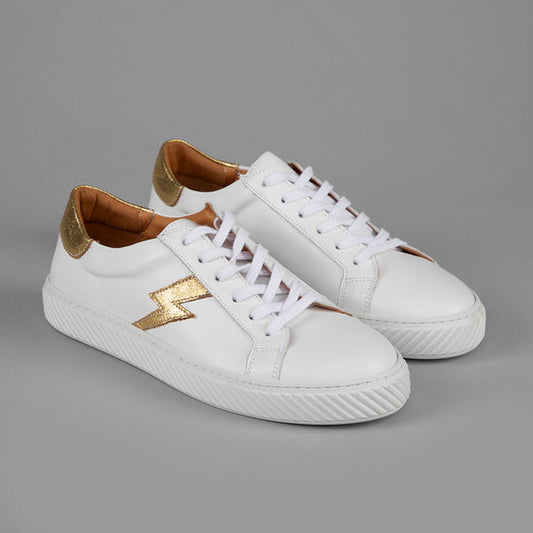 White leather trainers with gold lightning bolt