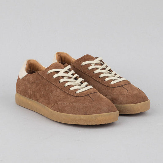 Warm brown suede trainer with white laces and tan rubber sole.