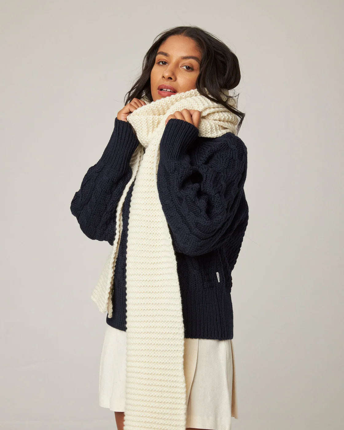 Oversized ecru cream chunky knit merino wool scarf from Peregrine Clothing, in extra-long length. Filtered on Shop My Palette for the Light Spring, Clear Spring, and Warm Spring colour seasons.