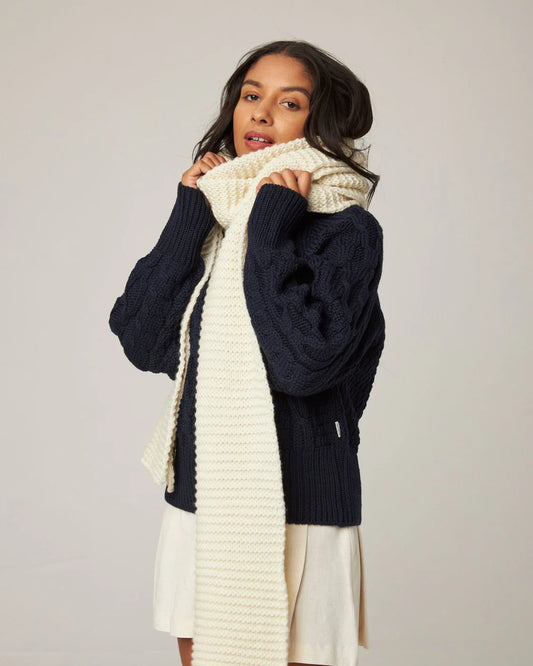 Oversized ecru cream chunky knit merino wool scarf from Peregrine Clothing, in extra-long length. Filtered on Shop My Palette for the Light Spring, Clear Spring, and Warm Spring colour seasons.