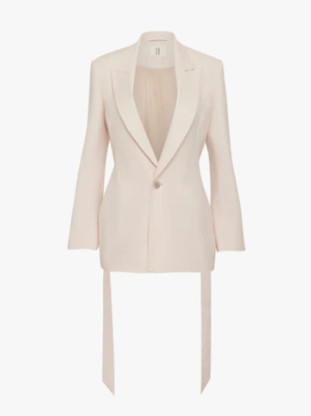 Blush pinky cream tie-waist jacket.