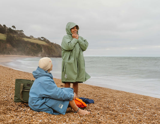 Sage green waterproof changing robe with hood.