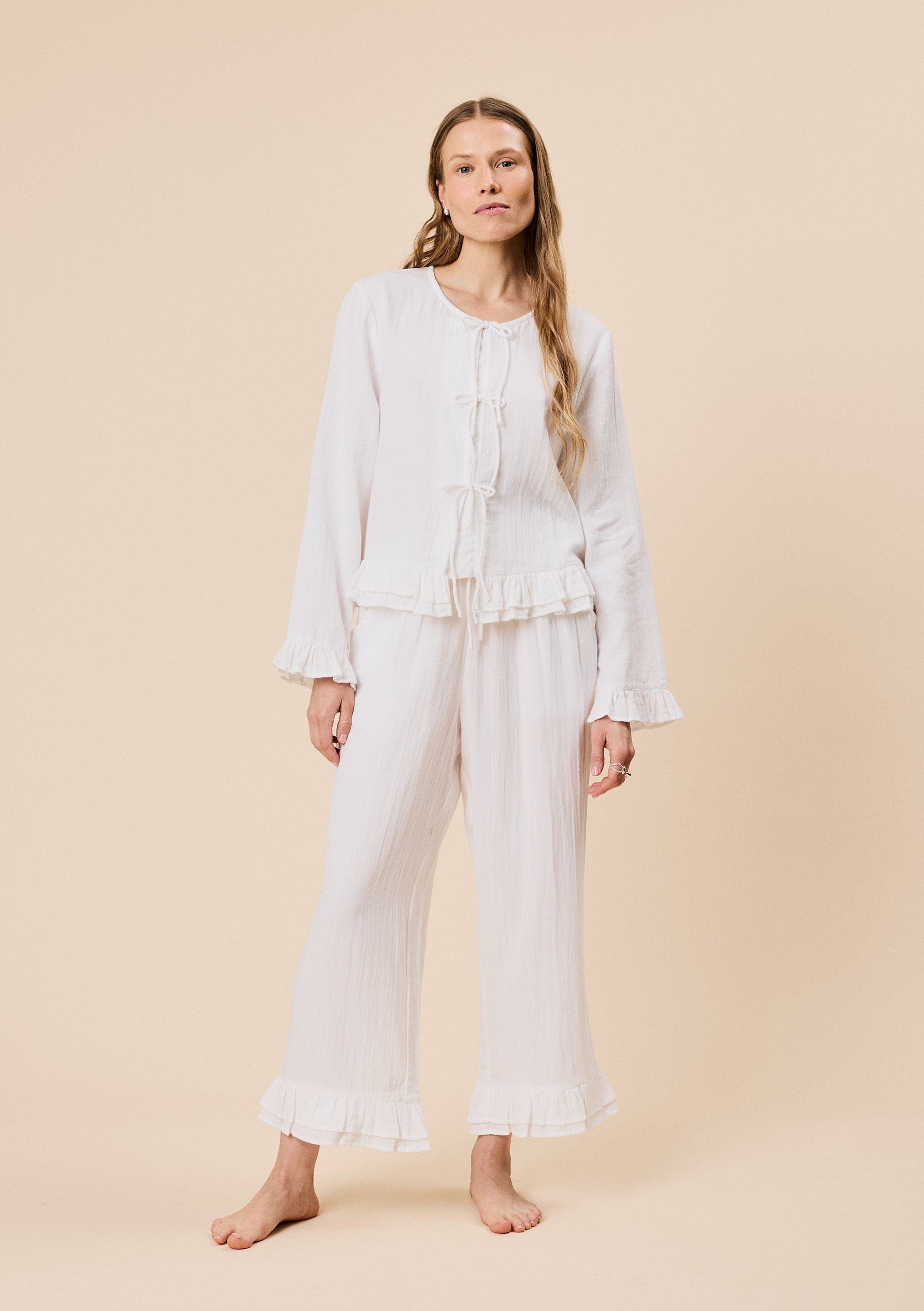 White cotton ruffle pyjamas.