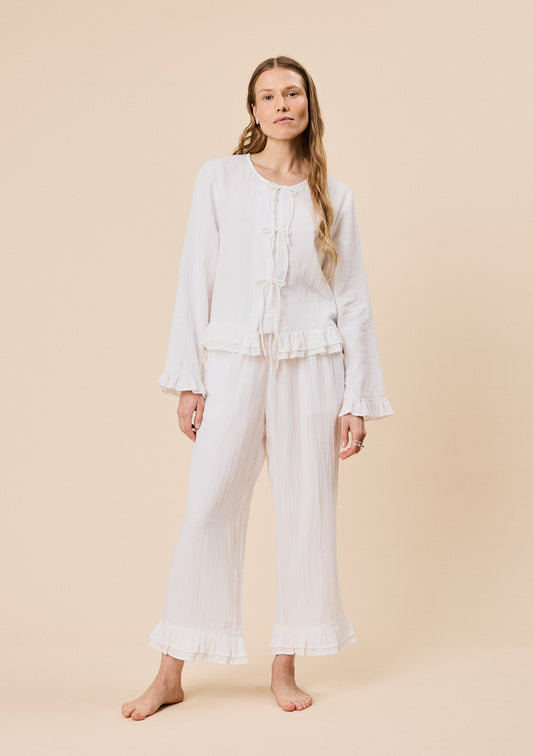 White cotton ruffle pyjamas.