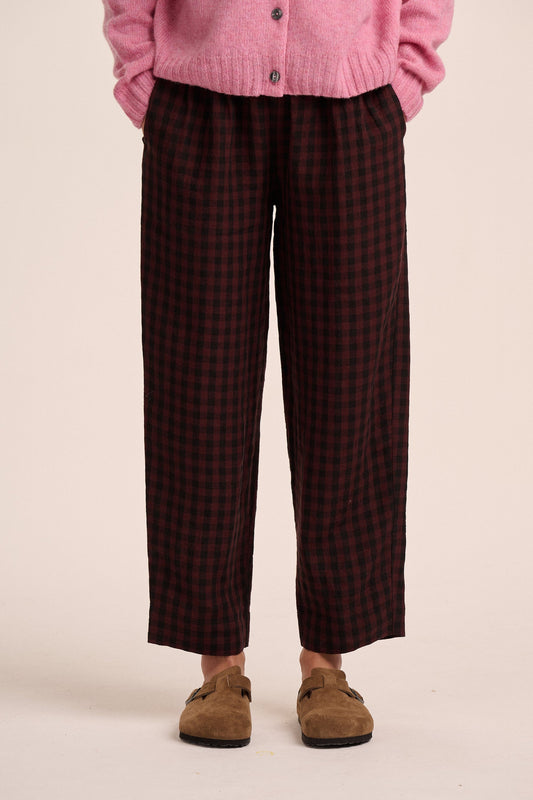 Deep burgundy check linen trousers.