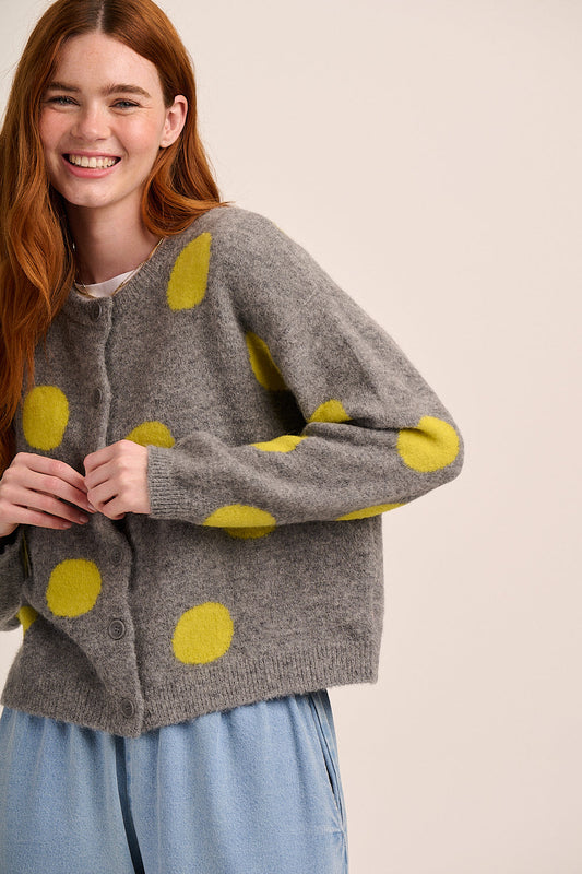 Grey knitted cardigan with yellow polka dots, button front, long sleeves, and soft textured finish.