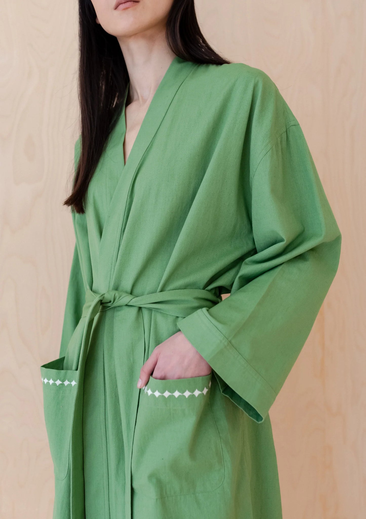 Close up of a grass green cotton robe. Robe is by TBCo and is filtered for the Clear Spring, Light Spring, and Warm Spring colour seasons by Shop My Palette.
