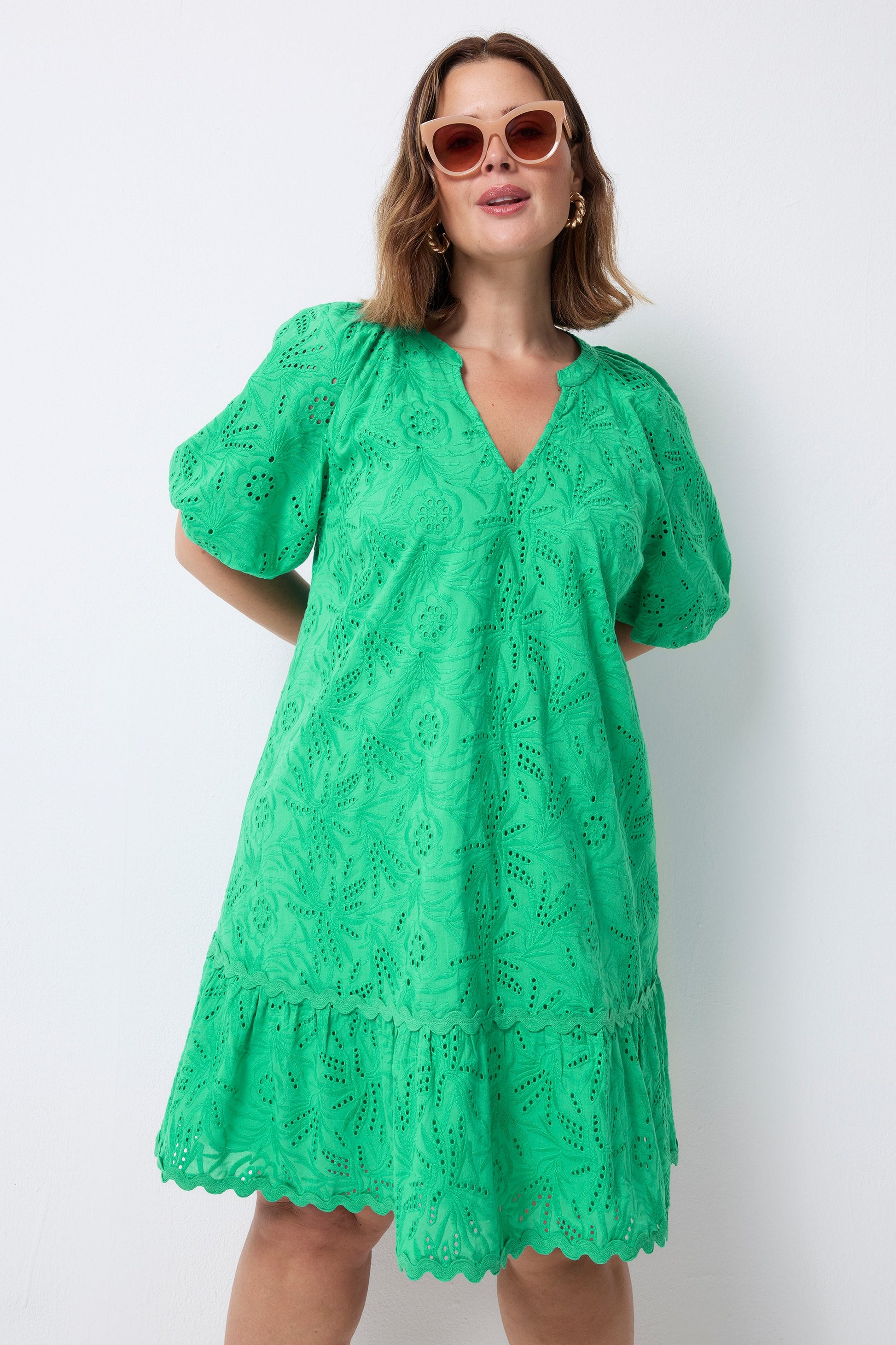 Bright green broderie anglaise mini dress.