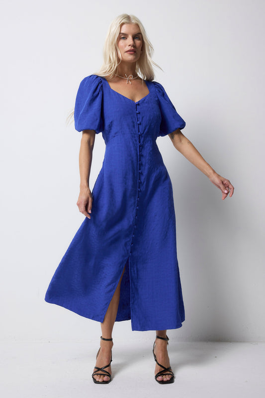 Cobalt blue midi dress with puff sleeves and sweetheart neckline.