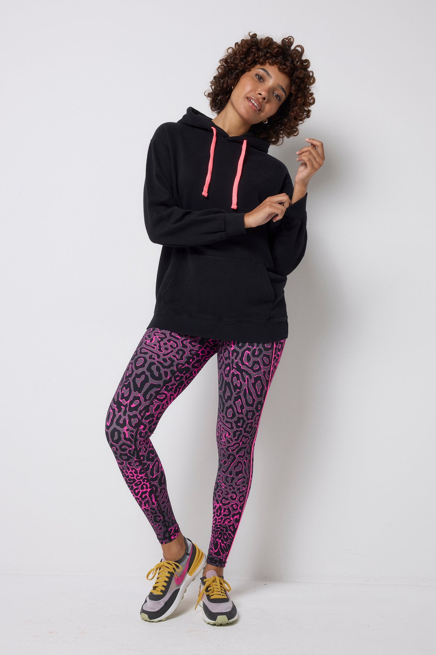 Neon pink leopard print activewear leggings.
