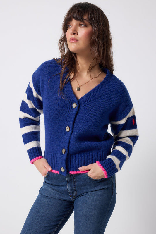 Cobalt blue cardigan with cream striped sleeves.