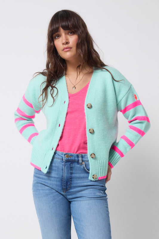 Light mint cardigan with bright pink striped sleeves.