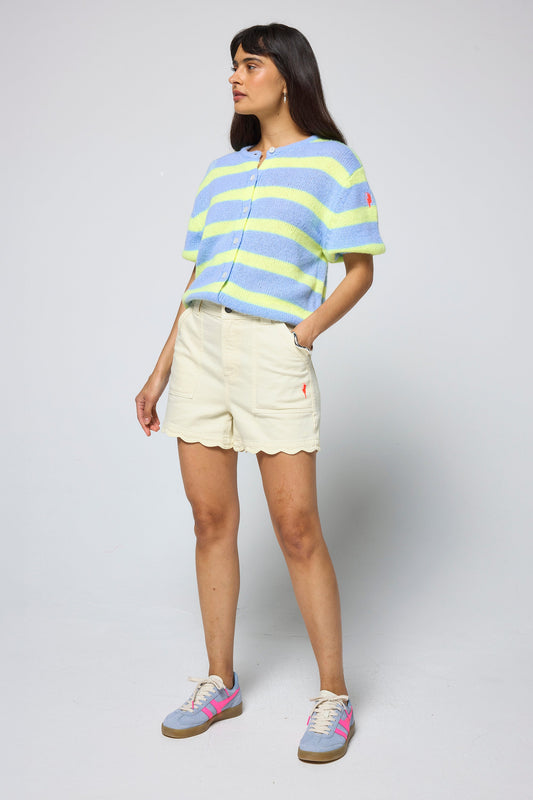 Pale lemon yellow scallop denim shorts.