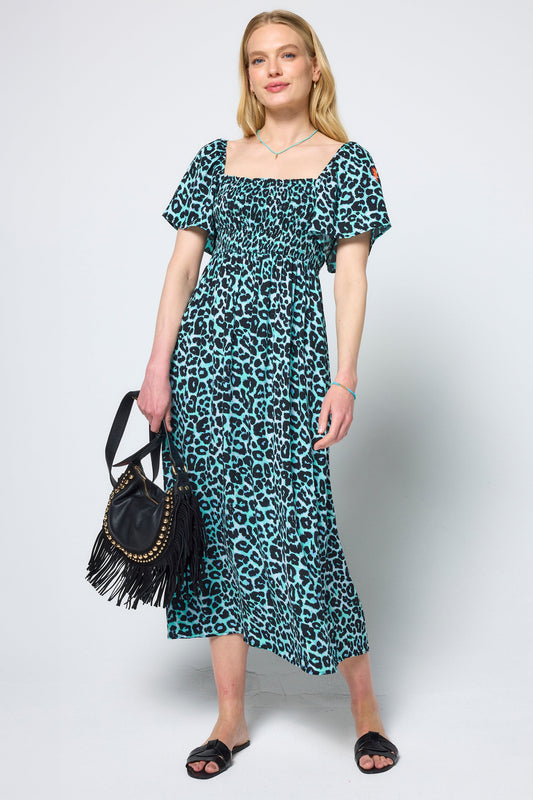 Mint green leopard print midi dress with puff sleeves and shirred bodice.