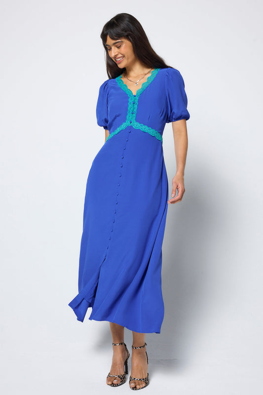 Cobalt blue tea dress with green lace trim.
