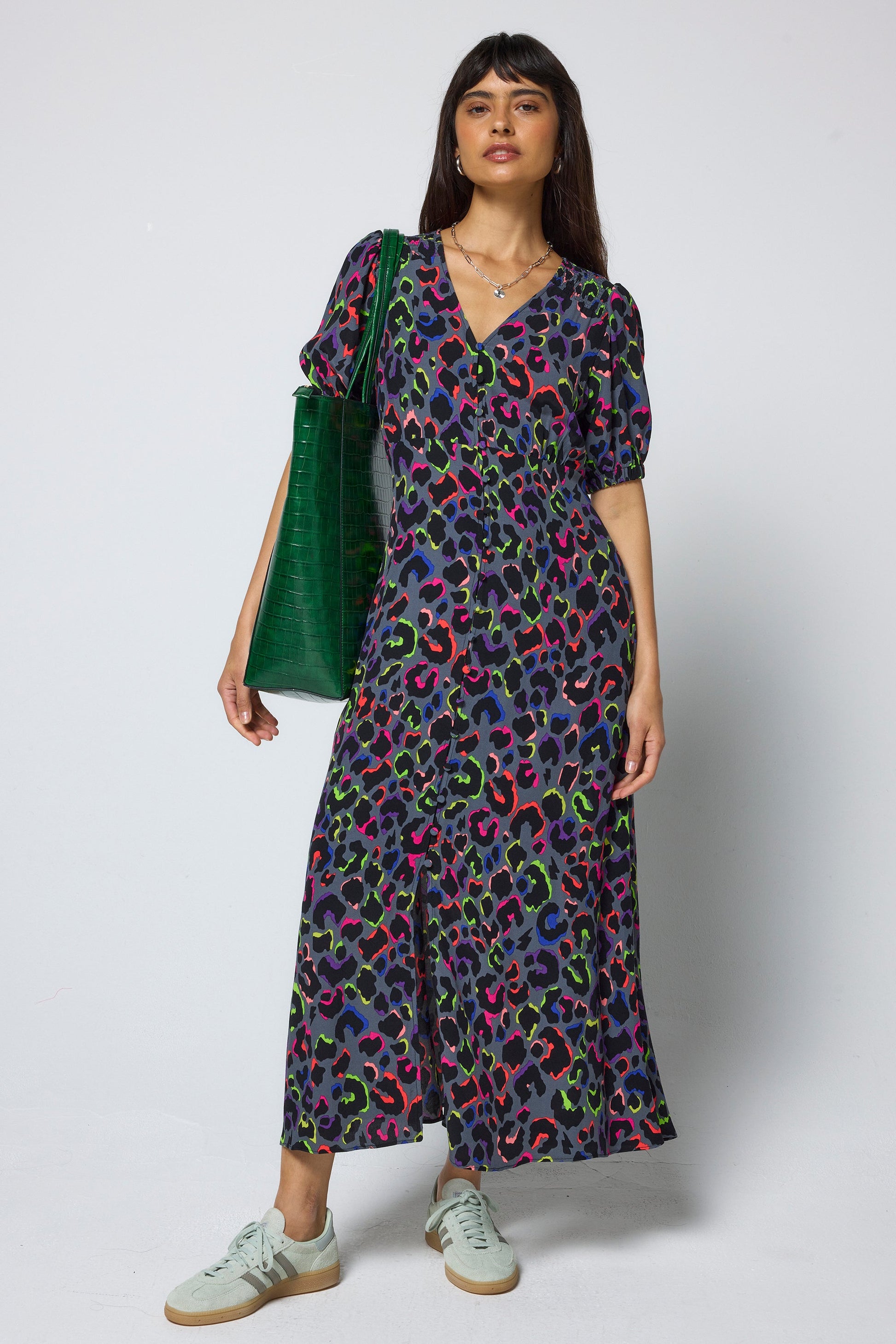 Charcoal leopard print with bold neon twists within the pattern.