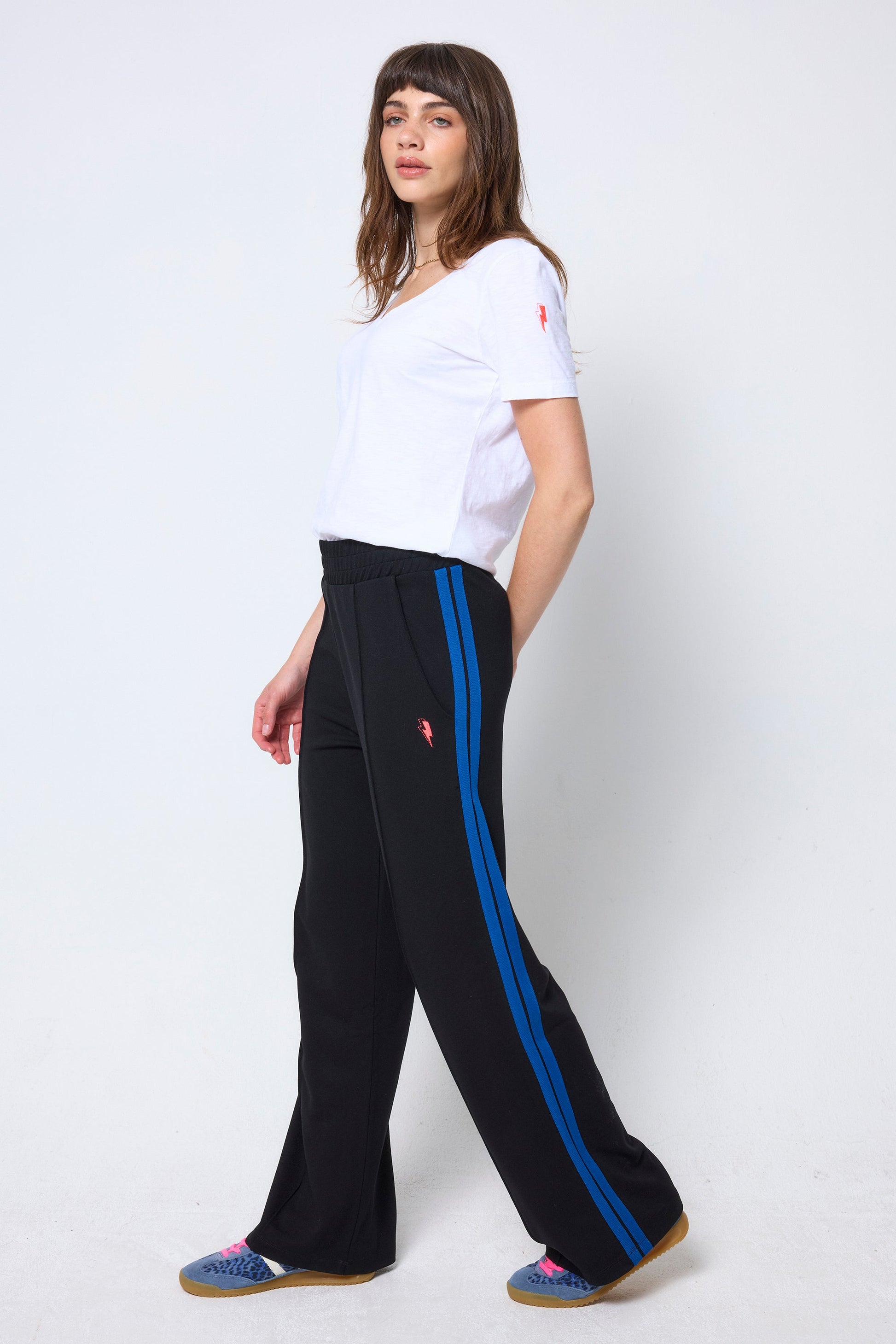 Black jersey trousers with cobalt blue side stripe.