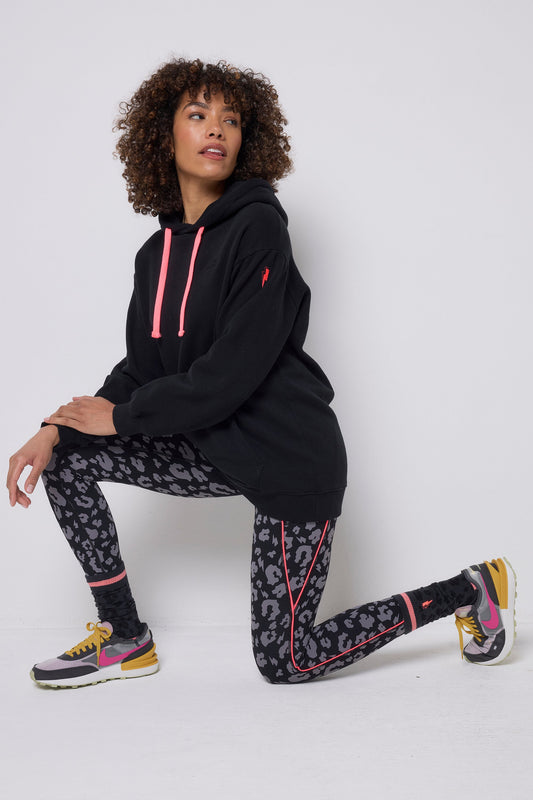 Black and charcoal leopard print activewear leggings.