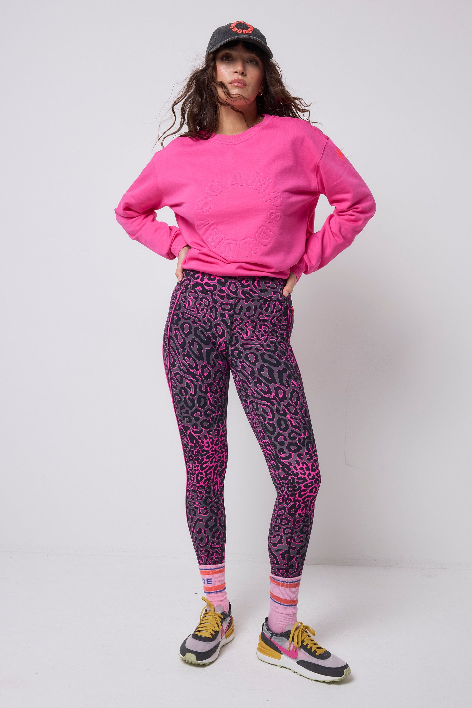 Bright fuchsia pink sweatshirt with embroidered "Scamp & Dude" logo on the chest.