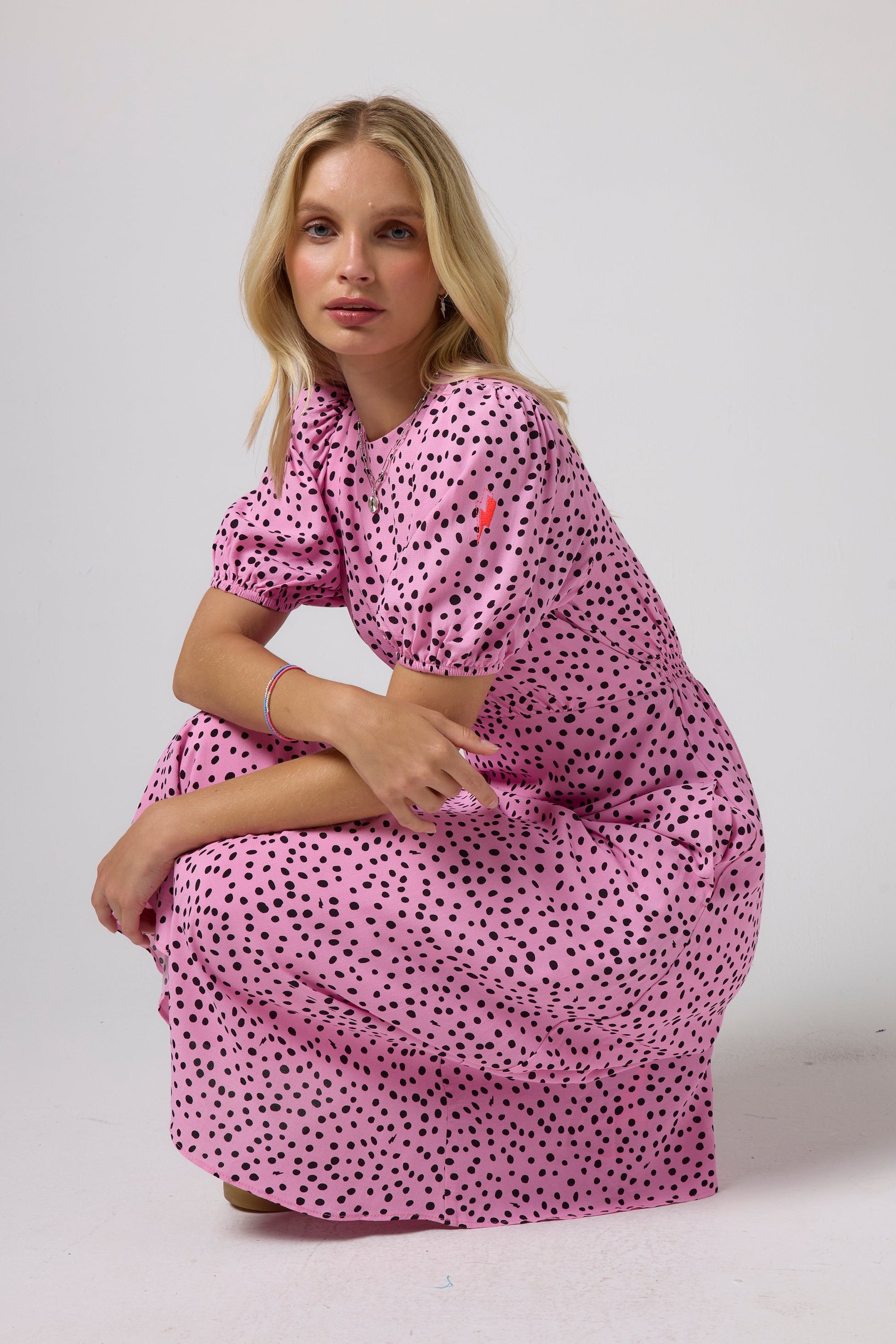 Pink polka dot midi dress.