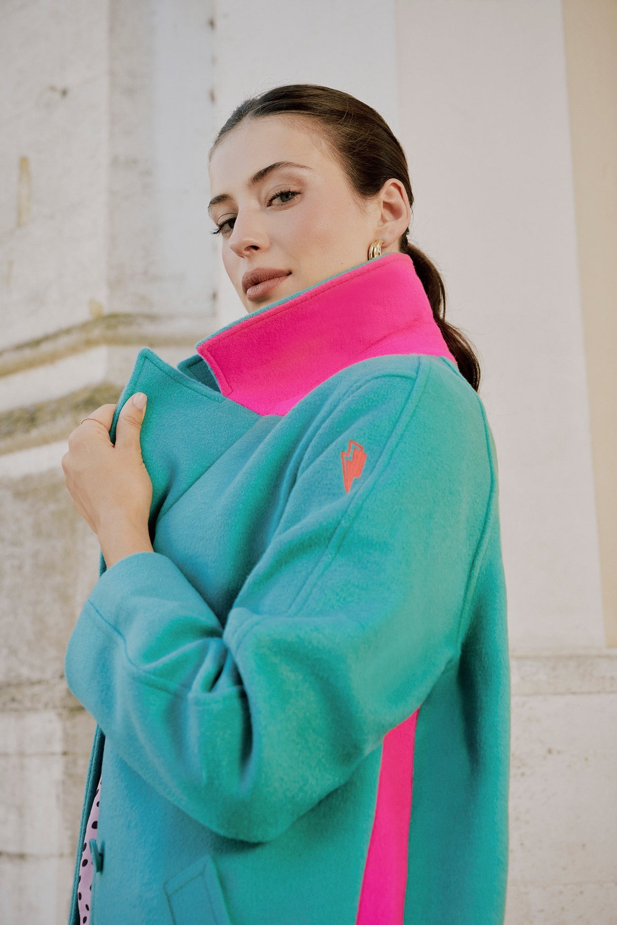 Teal and pink wool-blend coat.