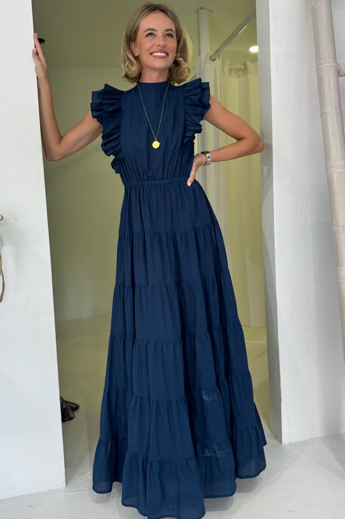 Navy frill maxi dress with bow tie back.