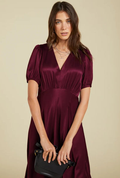 Deep burgundy satin dress.