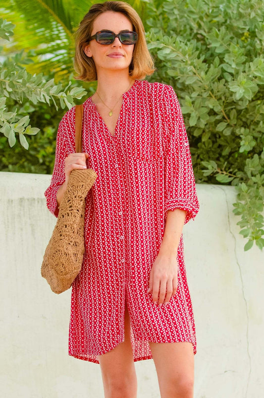 Red and white geometric pattern shirt dress.