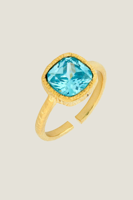 Gold ring with turquoise gemstone.