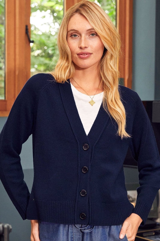 Navy button-through cardigan with V-neckline, long sleeves, and ribbed hem and cuffs.