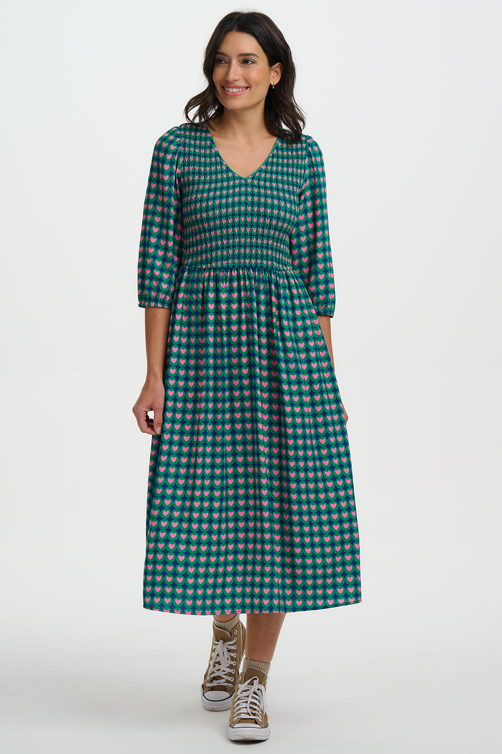 Shirred midi dress in 100% LENZING ECOVERO viscose, with pink and navy heart pattern over a green background.