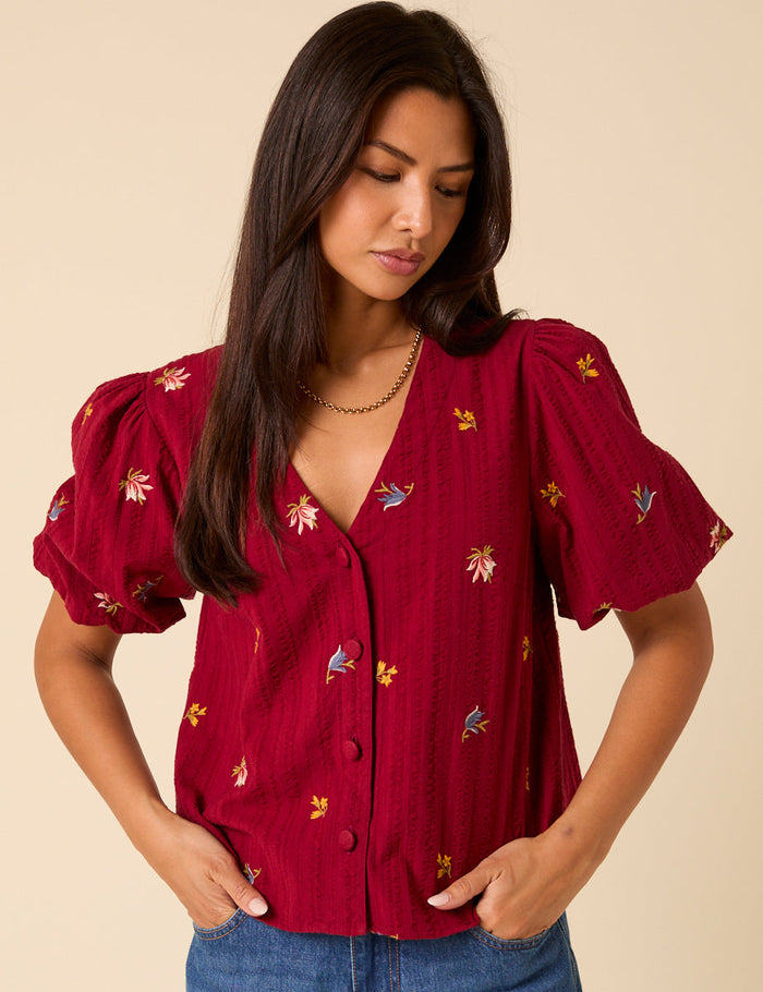 Deep red embroidered puff sleeve top.
