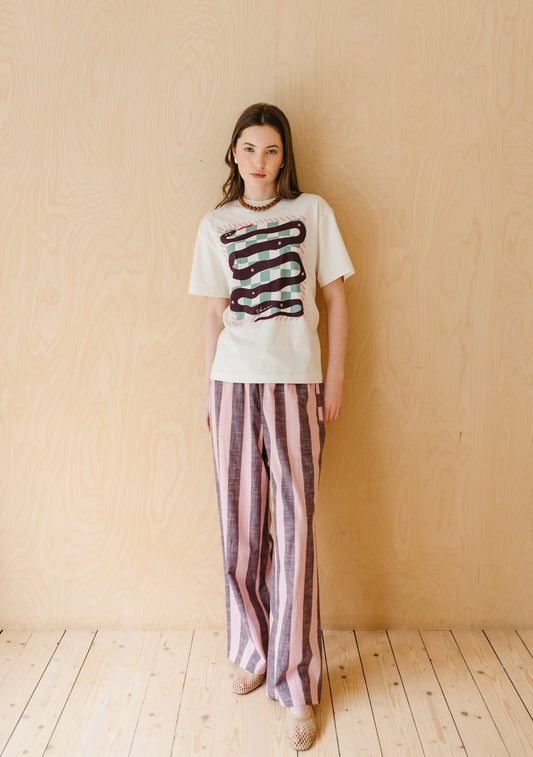 Pink and grey striped trousers with vertical stripes, elasticated waistband, and relaxed straight-leg fit