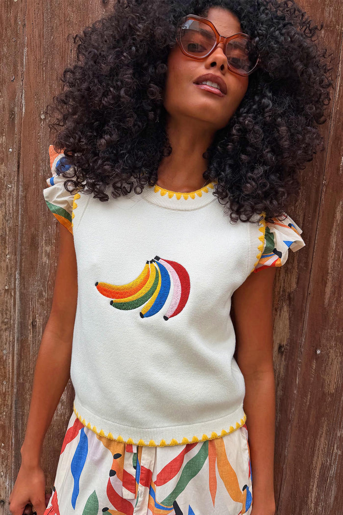 Cream knitted tank top with embroidered banana motif.