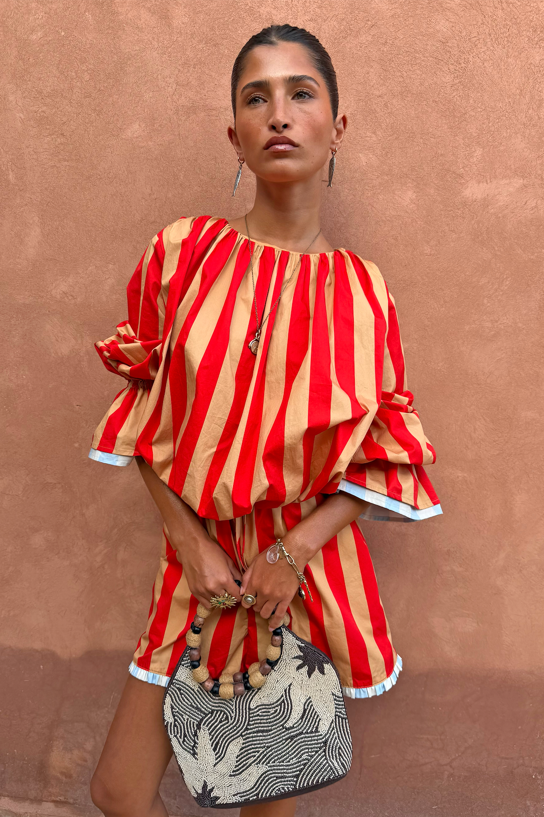 Tomato and camel stripe puff-sleeve blouse.