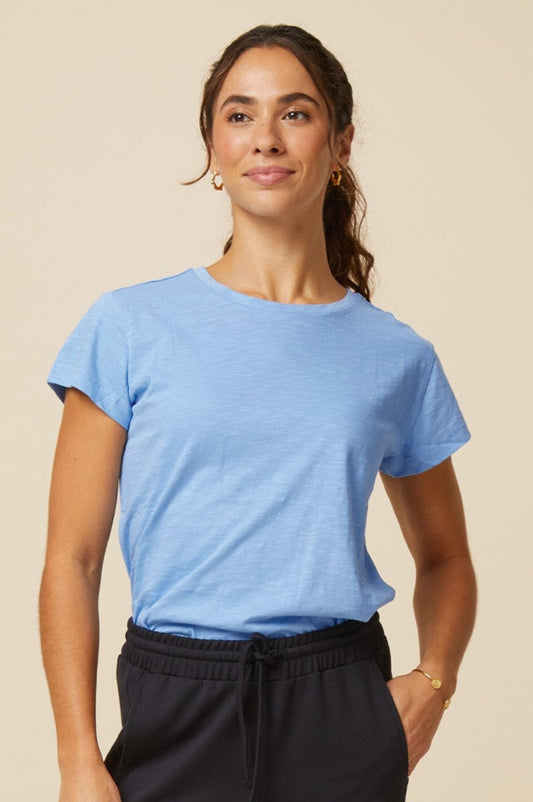 Light blue short-sleeve T-shirt with a round neckline and relaxed fit.