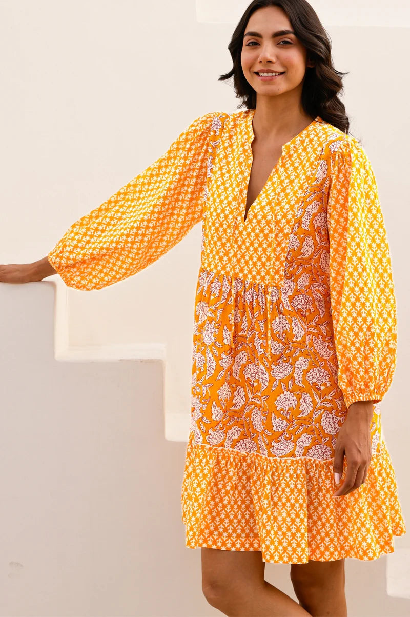 Woman wearing a yellow floral dress against a white background. This organic cotton kaftan from Aspiga has been filtered for the Clear Spring, Warm Spring, and Light Spring colour seasons by Shop My Palette.