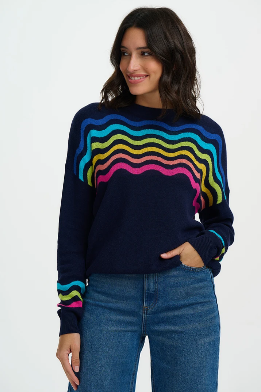 Navy jumper with bright rainbow waves.