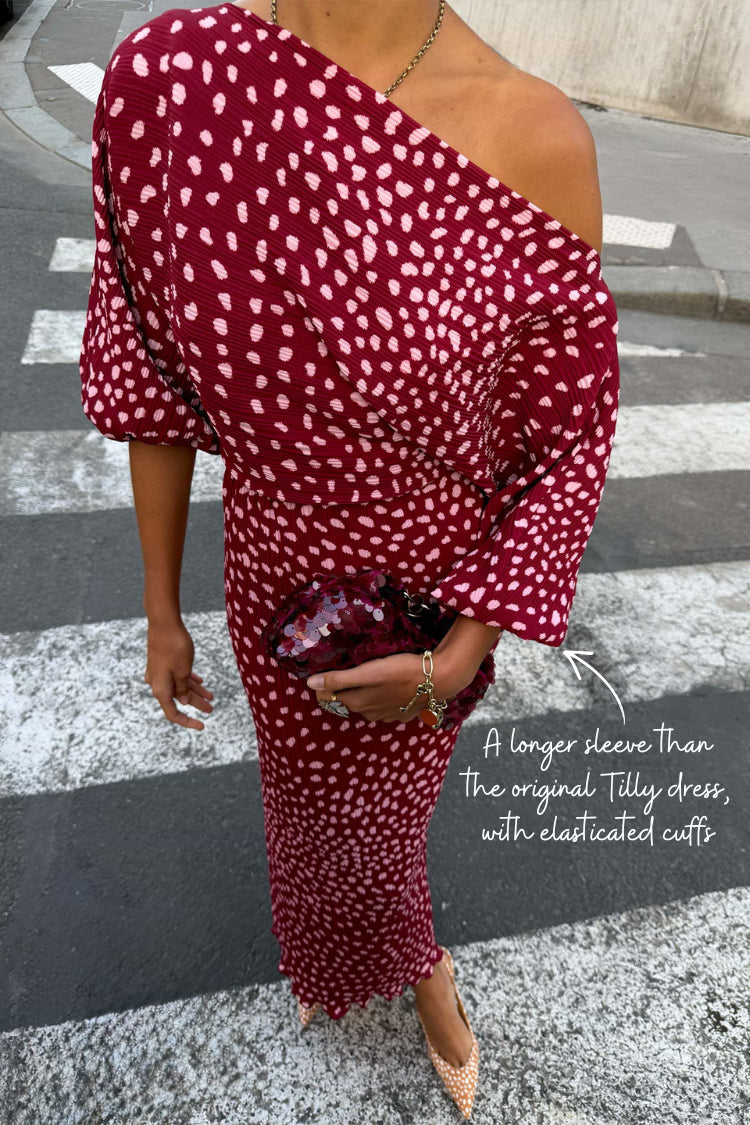 Burgundy off-the-shoulder dress.