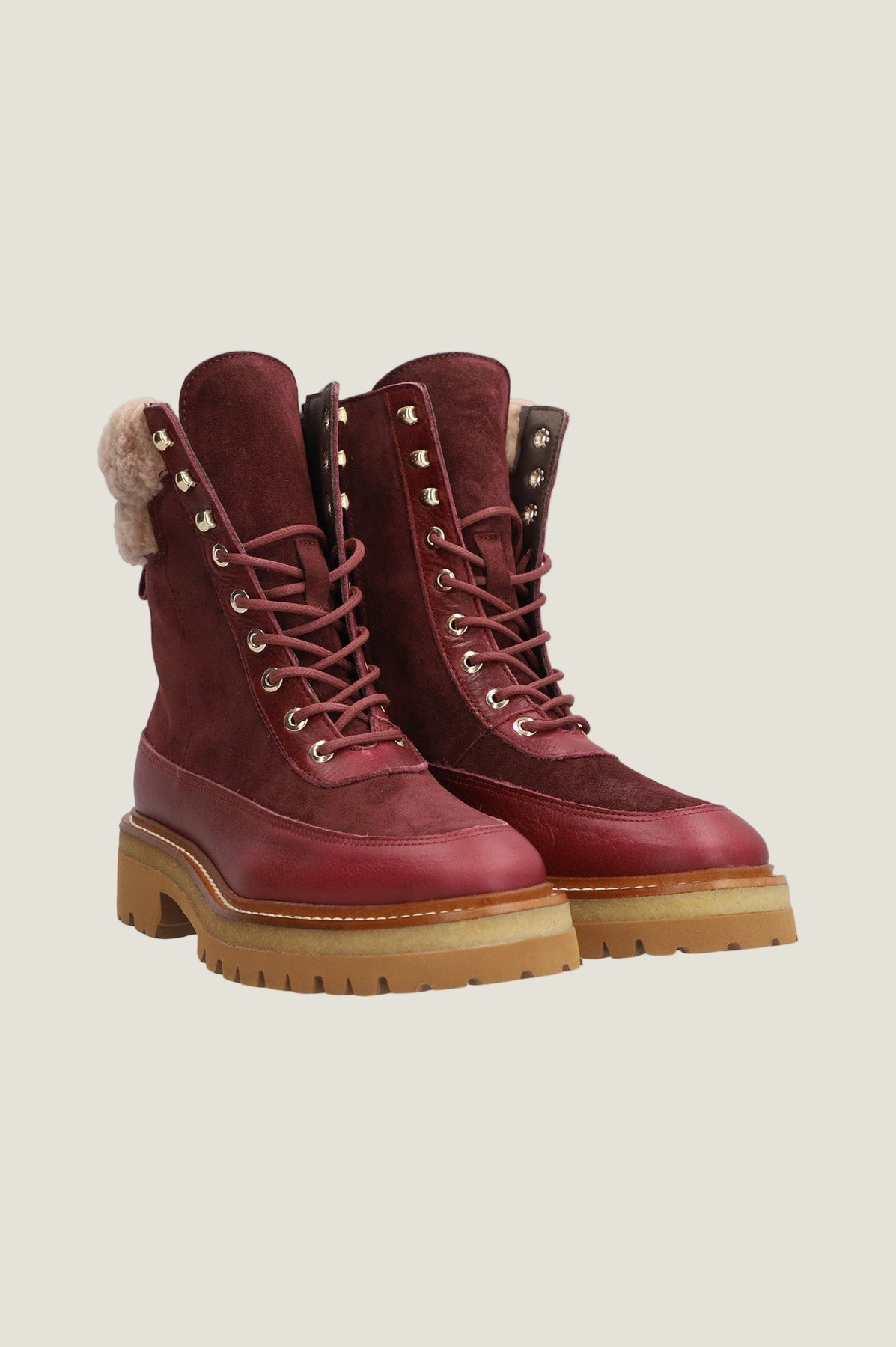 Burgundy suede boots.