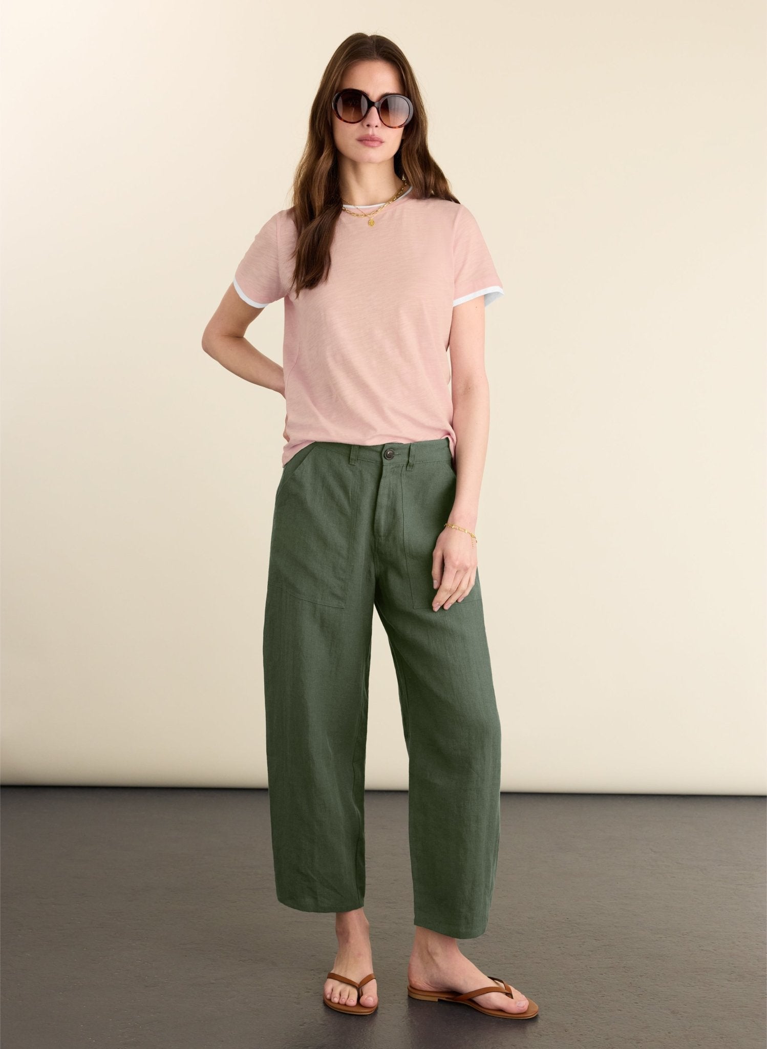 Soft olive green linen barrel leg trousers.