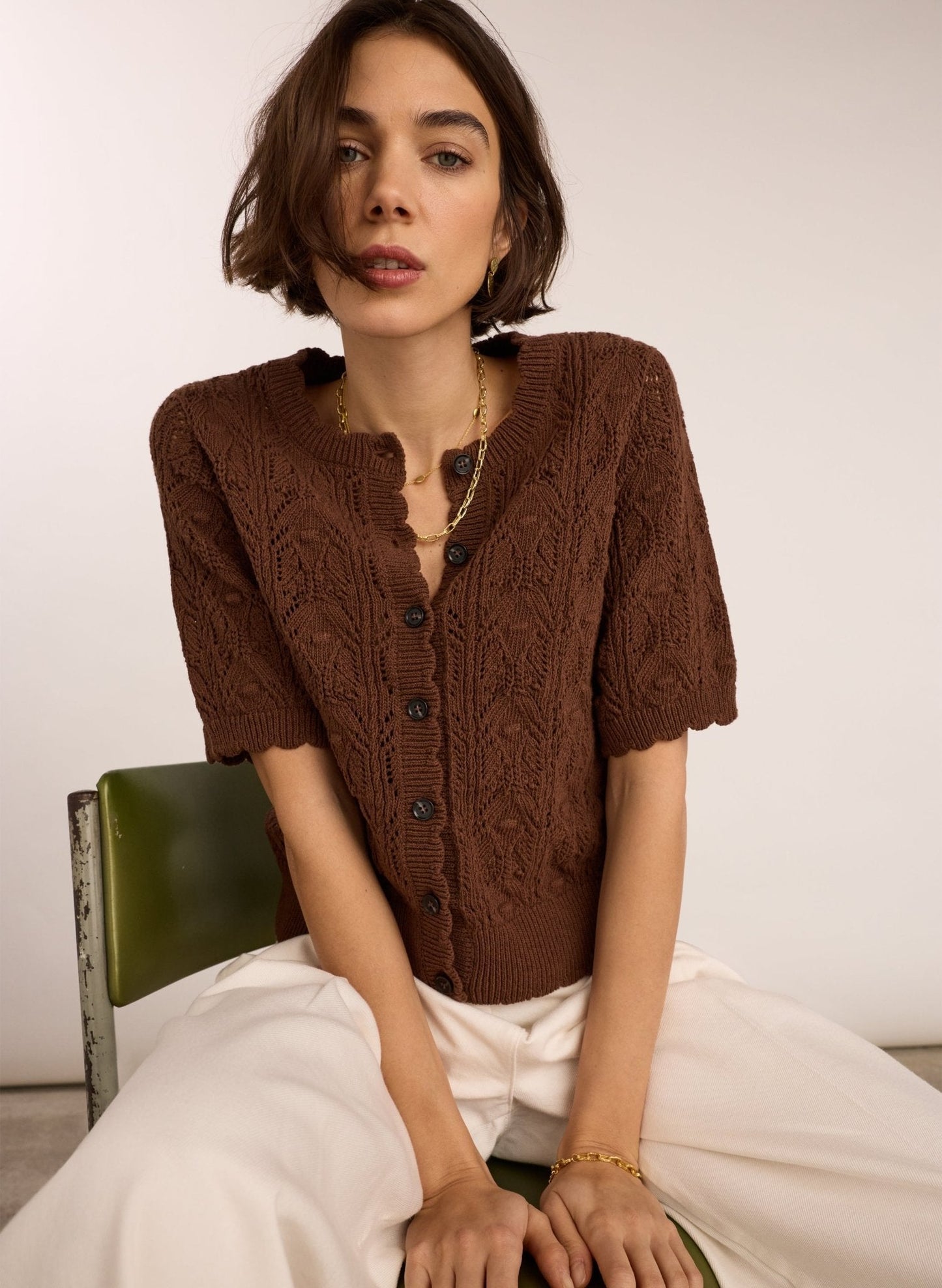 Chocolate brown short sleeved crochet round neck cardigan.