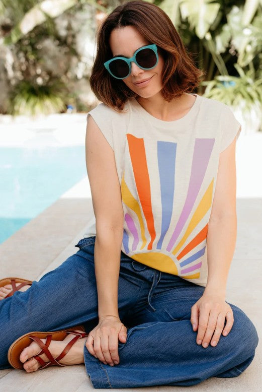 Off-white t-shirt with rainbow sunburst design.