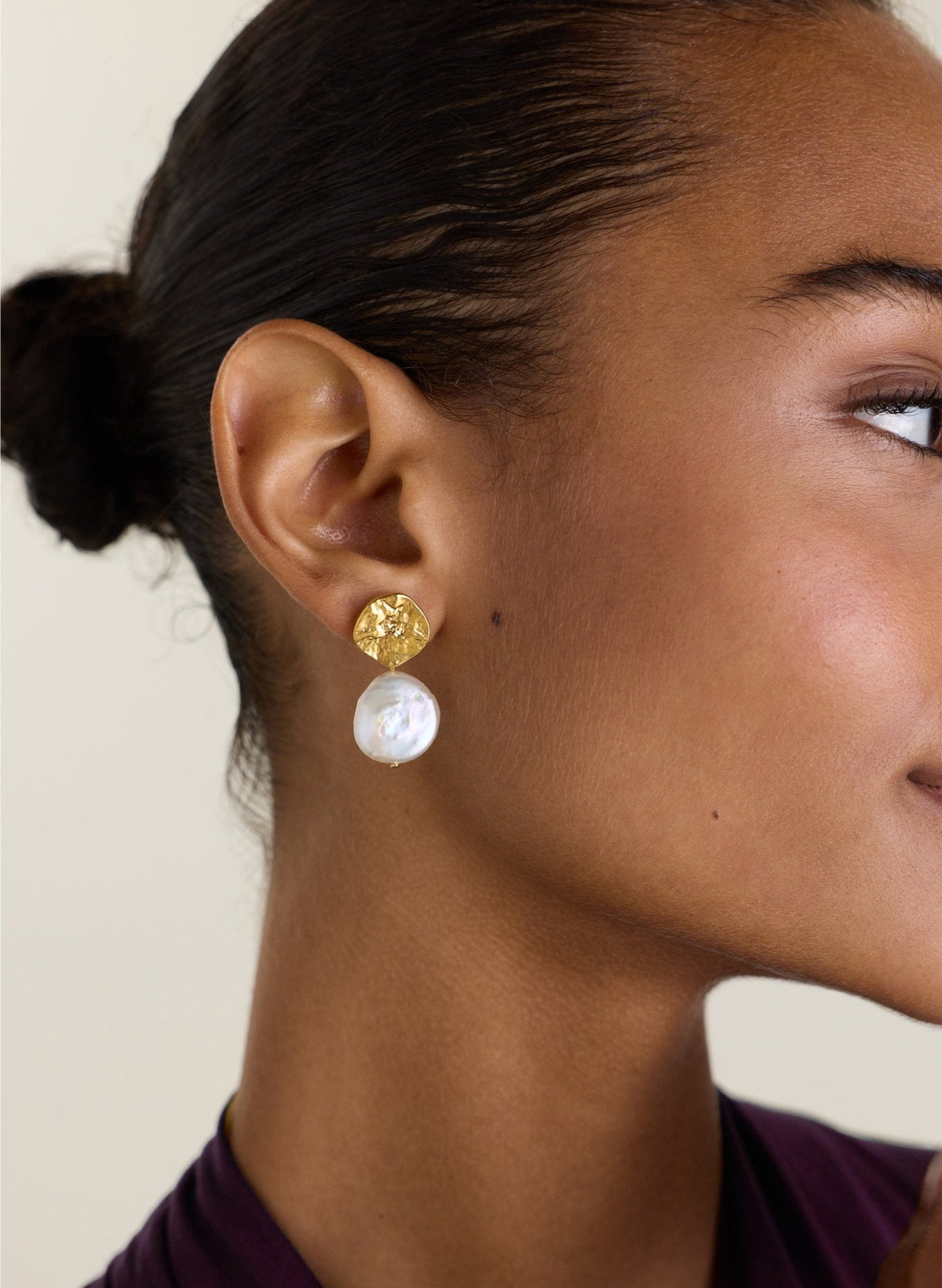 Hammered gold disk earrings with freshwater pearl drop.